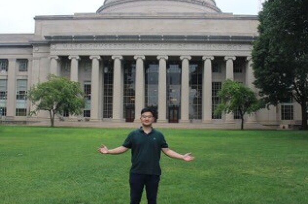Haldrian standing on campus at MIT